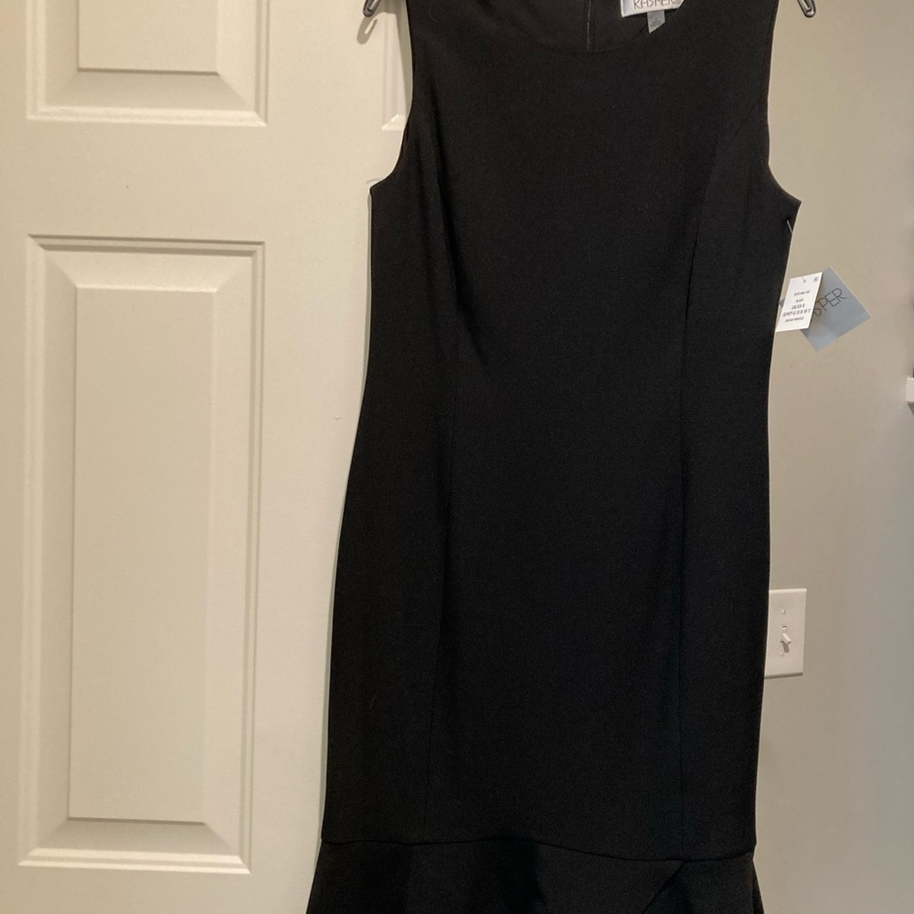 Kasper black sheath With slight ruffle bottom.  New with tags.  Size 8